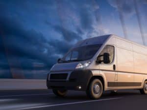 white commercial vehicle on road