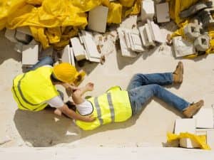 man on ground after construction site accident