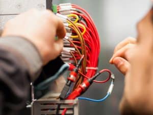 person touching wires, which can lead to electrocution